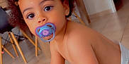 Cassie participe au concours pour gagner de l'argent avec cette photo : toddler, child, pacifier, indoor, curly_hair, crawling, floor, diaper, heart_overlay, furniture, table, chair, home, cute, baby, young_child, skin, person, expression, playful