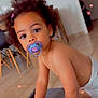 toddler, child, pacifier, indoor, curly_hair, crawling, floor, diaper, heart_overlay, furniture, table, chair, home, cute, baby, young_child, skin, person, expression, playful