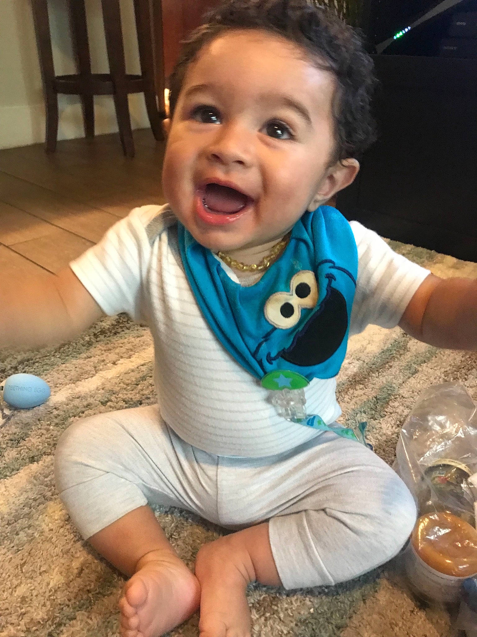 Arthur is registered to the contest to win money with this photo: baby, baby_toddler_clothing, cheek, child, cool, face, fun, head, person, play, sitting, skin, smile, toddler