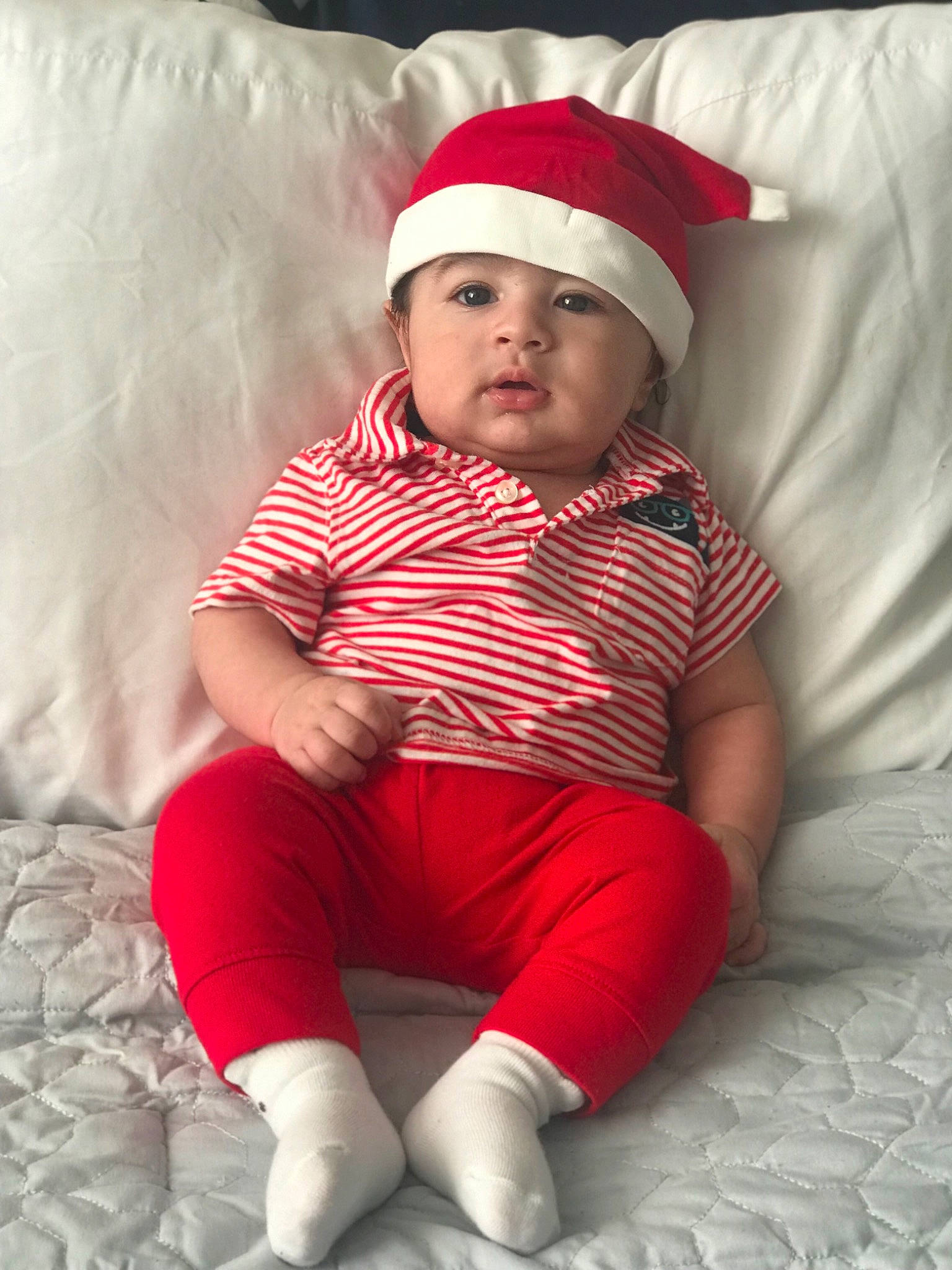 Arthur is registered to the contest to win money with this photo: baby, child, christmas, fictional_character, headgear, headwear, person, red, skin, toddler