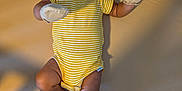 Jedi joined the competition — help win amazing prizes! baby, infant, onesie, mittens, yellow_stripes, lying_down, smiling, happy, face, skin, legs, feet, bed, mattress, shadow, indoors, soft_light, curly_hair, child, person