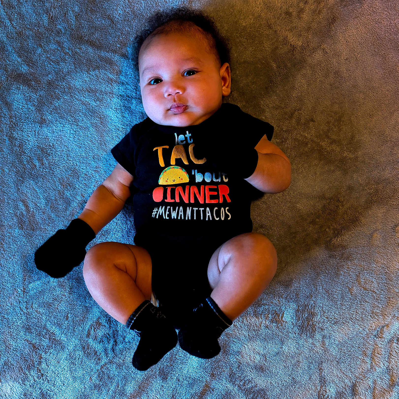 Jedi joined the competition — help win amazing prizes! apparel, baby, blanket, child, clothing, cute, expression, face, indoor, infant, lying_down, mittens, onesie, person, portrait, skin, socks, taco, text, young