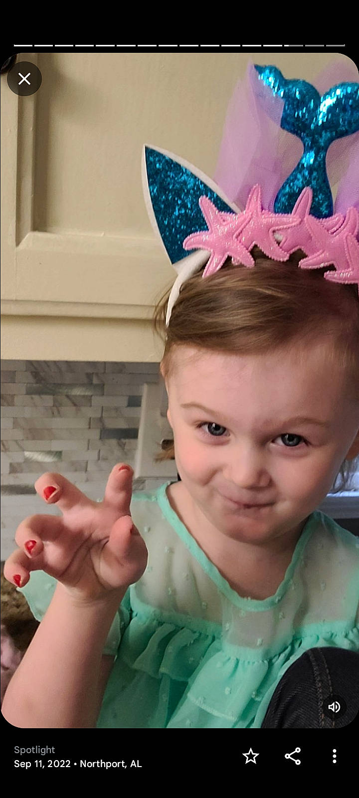 Evie is registered to the contest to win money with this photo: chin, costume_hat, ear, eyebrow, eyelash, forehead, gesture, hair_accessory, happy, headband, headgear, headpiece, human, joy, mammal, person, pink, skin, smile, thumb