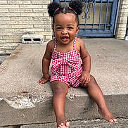 Nichol Mae Harris is registered to the contest to win money with this photo: toddler, child, smiling, outdoor, concrete, steps, red_checkered, hair_puffs, barefoot, cute, happy, person, sitting, playful, young_child, casual_clothing, daylight, porch, front_door, expression