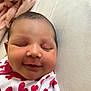 Jaylani is registered to the contest to win money with this photo: baby, baby_girl, blanket, closeup, clothing, cute, face, head, heart_pattern, indoors, infant, newborn, peaceful, person, portrait, resting, skin, sleeping, smiling, soft
