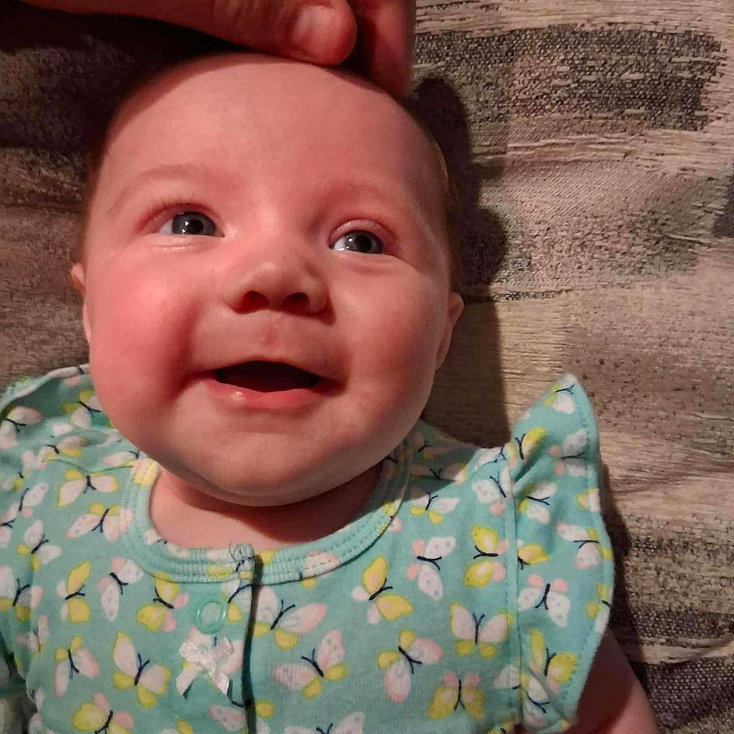 Lakoda is registered to the contest to win money with this photo: apparel, baby, baby_girl, butterfly, cheerful, child, closeup, clothing, cute, fabric, face, hand, happiness, head, infant, pattern, person, portrait, skin, smile