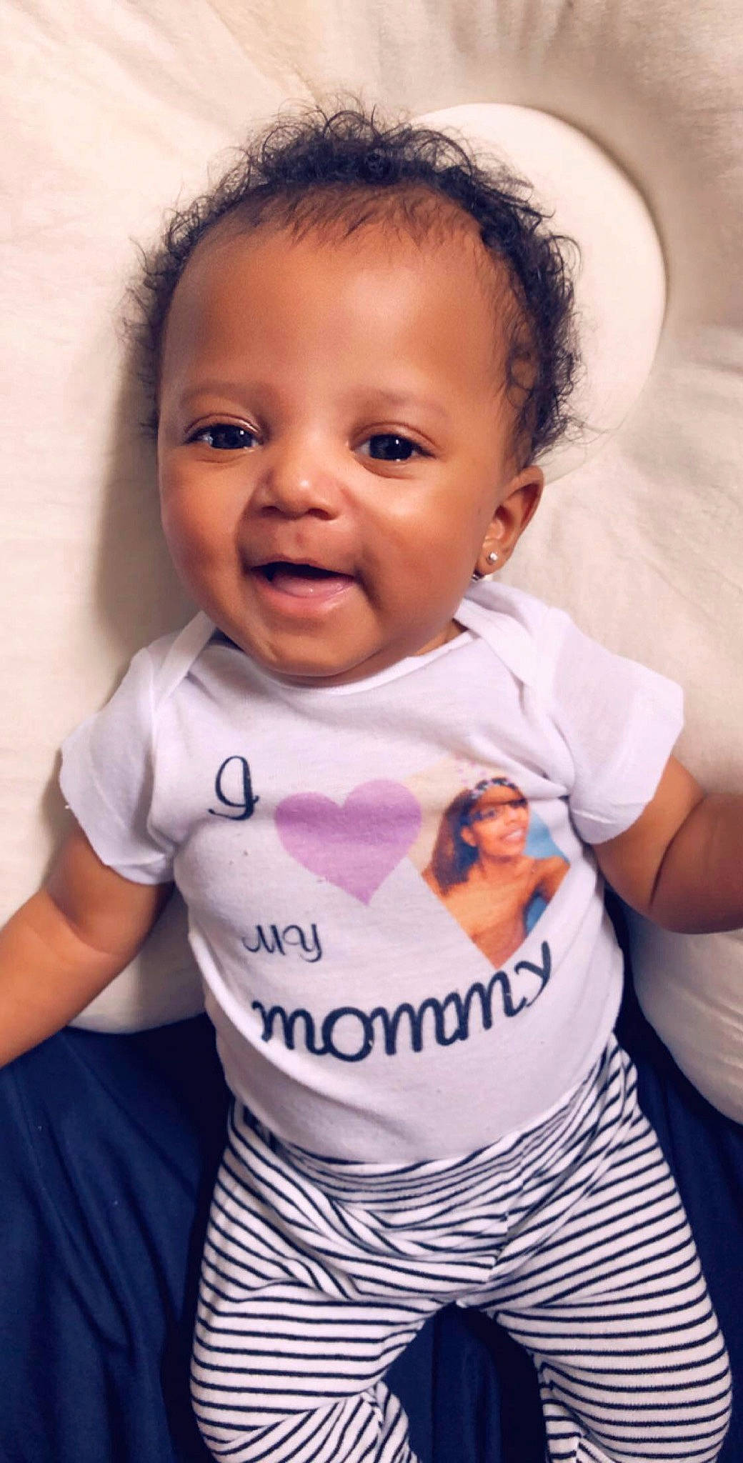 Skylar is registered to the contest to win money with this photo: baby, baby_laughing, baby_products, baby_toddler_clothing, cheek, child, daughter, face, facial_expression, happy, head, lip, people, person, pink, product, skin, sleeve, smile, t_shirt