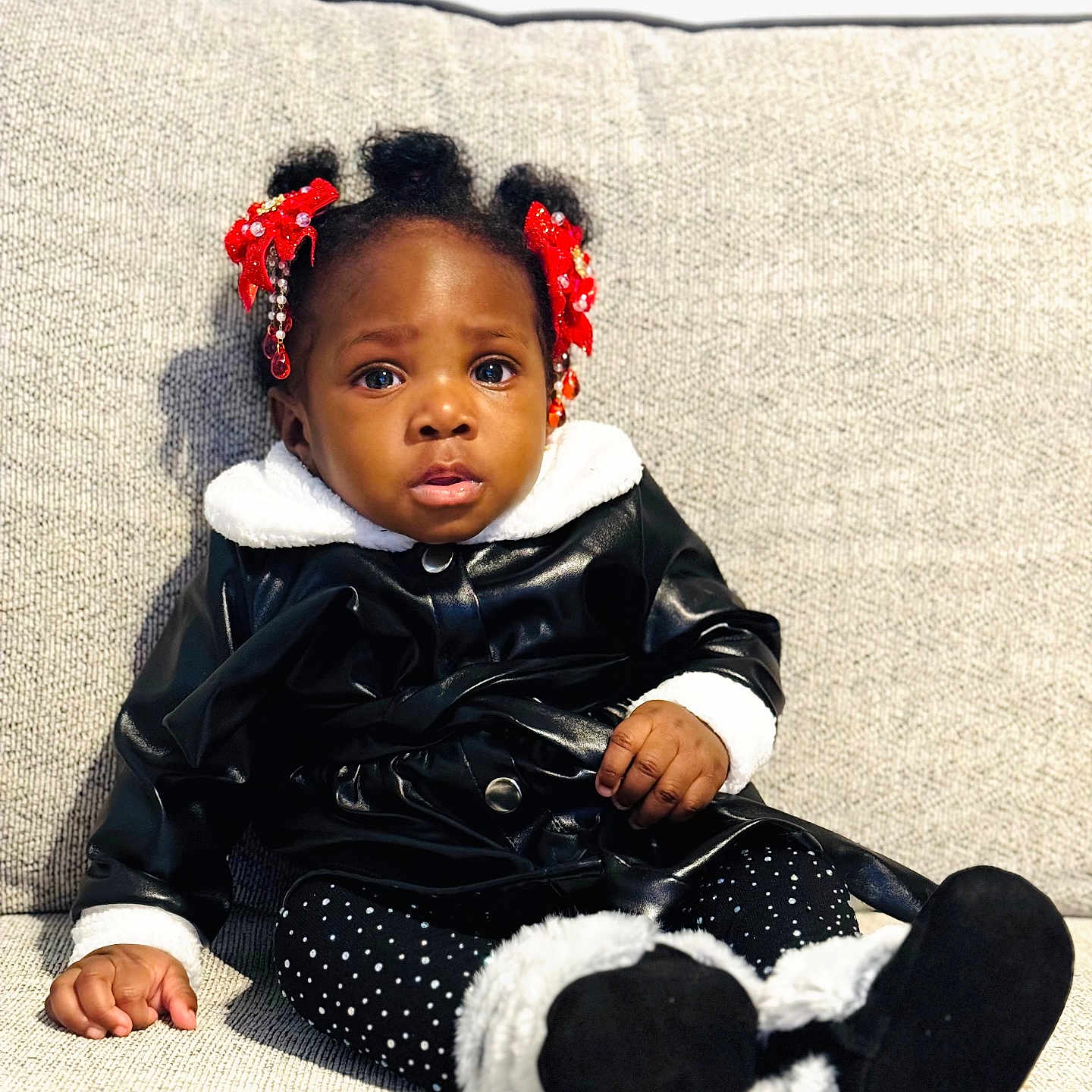 Selaphiel joined the competition — help win amazing prizes! beads, black_jacket, child, clothing, couch, cozy, cute, expression, face, footwear, furniture, hair, indoor, person, polka_dot_leggings, portrait, red_bows, sitting, toddler, white_fur