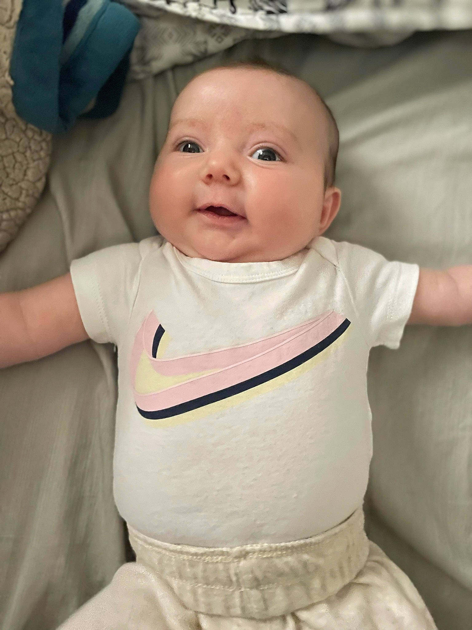 Ella is registered to the contest to win money with this photo: arm, baby, baby_toddler_clothing, cheek, chin, dress, eye, eyebrow, face, hair, hand, head, human_body, lip, mouth, neck, nose, person, skin, sleeve