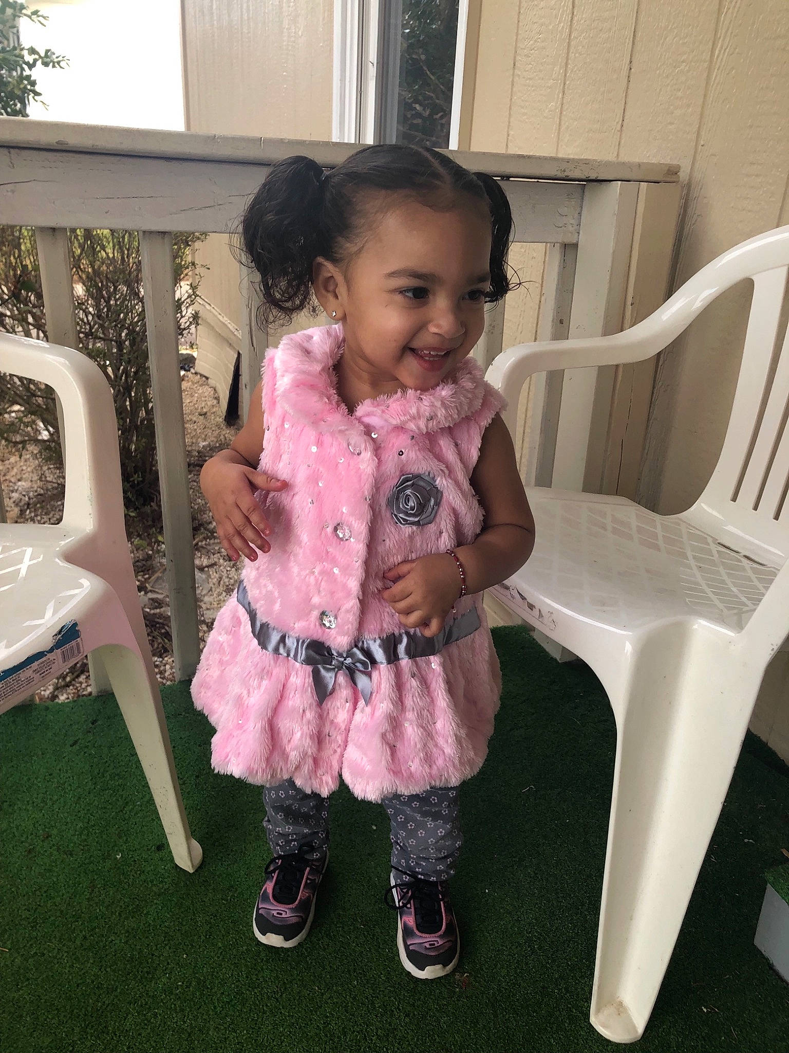 Kaelyn joined the competition — help win amazing prizes! baby, chair, child, dress, joy, outerwear, person, pink, sitting, skin, smile, toddler