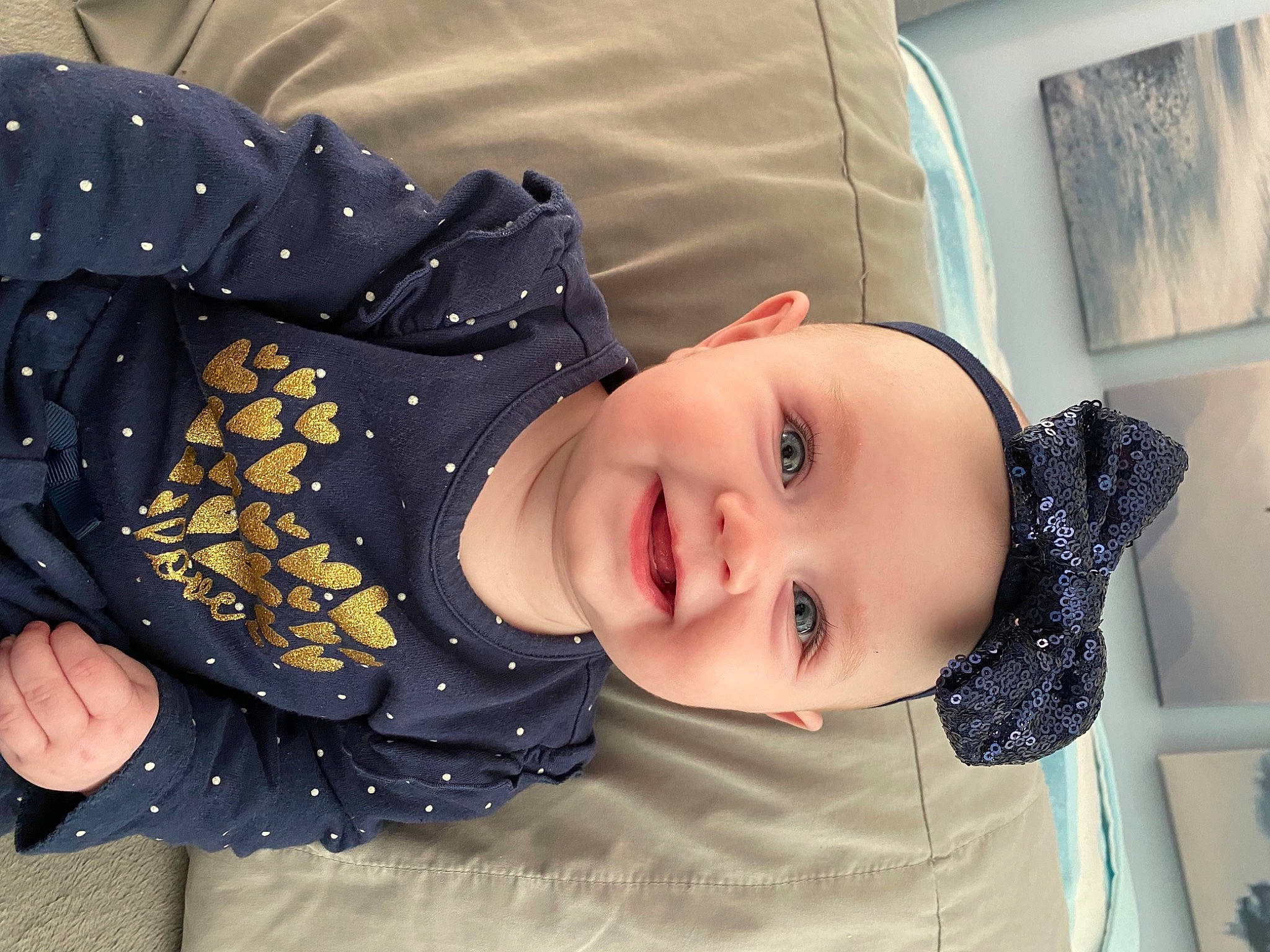 Juniper is registered to the contest to win money with this photo: baby, baby_laughing, baby_products, baby_toddler_clothing, cheek, child, comfort, facial_expression, fashion_accessory, flash_photography, fun, happy, headwear, joy, laugh, pattern, person, portrait_photography, sitting, sleeve