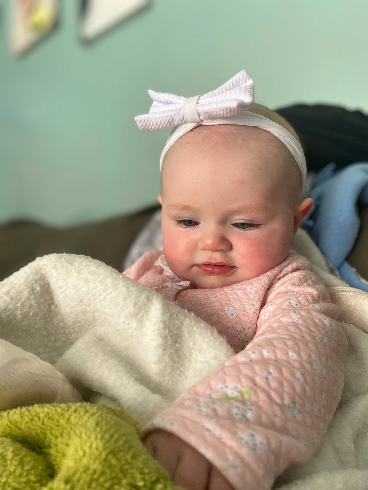 Juniper is registered to the contest to win money with this photo: baby, baby_products, baby_sleeping, baby_toddler_clothing, cheek, child, comfort, eye, eyelash, finger, grass, headgear, iris, linens, nail, person, sitting, skin, thumb, toddler