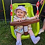 Lyanna participe au concours pour gagner de l'argent avec cette photo : baby, child, clothing, footwear, fun, garden, grass, green, hand, happy, hat, outdoor, person, play, purple, rope, smile, sock, summer, swing