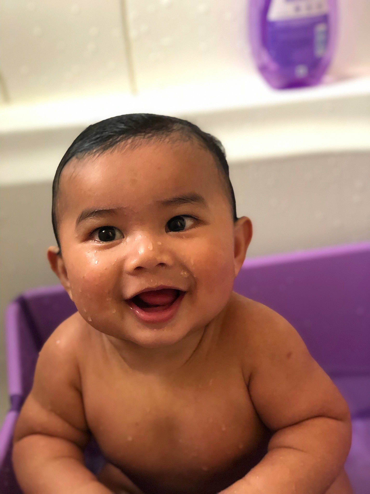 Ernest is registered to the contest to win money with this photo: baby, baby_bathing, baby_making_funny_faces, bathing, cheek, child, chin, eyebrow, face, facial_expression, forehead, fun, happy, head, laugh, mouth, nose, person, skin, smile