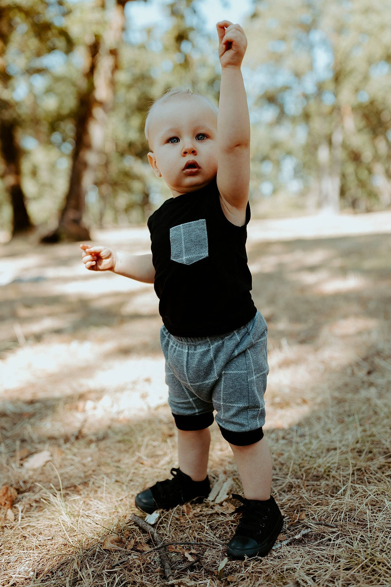 Trystin joined the competition — help win amazing prizes! baby, child, flash_photography, fun, gesture, grass, happy, human_leg, people_in_nature, person, plant, recreation, shorts, spring, standing, sunlight, t_shirt, toddler, tree, wood