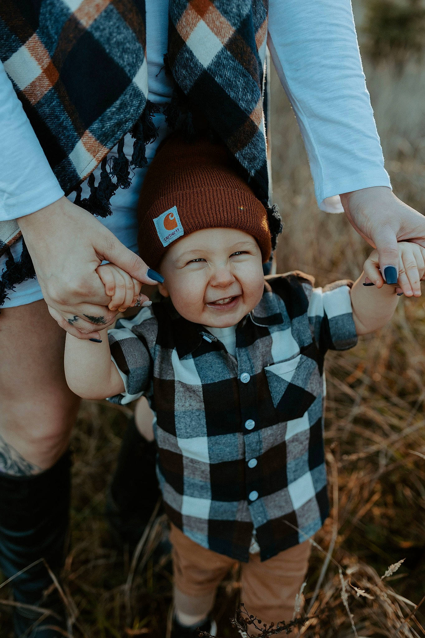 Trystin joined the competition — help win amazing prizes! arm, cap, face, finger, gesture, grass, hand, happy, hat, head, headgear, headwear, people_in_nature, person, plaid, plant, smile, tartan, textile, thumb