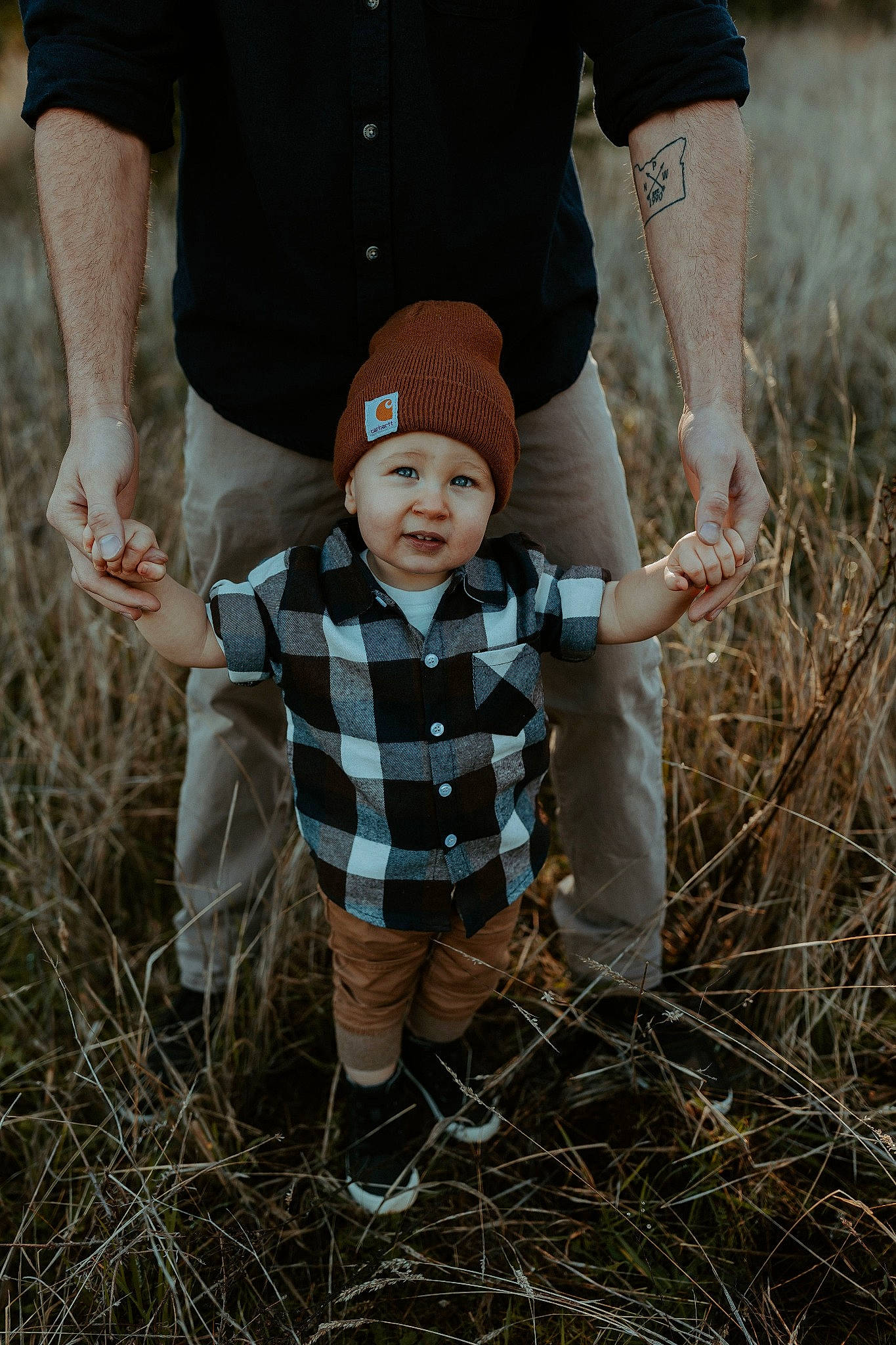 Trystin joined the competition — help win amazing prizes! baby, baby_toddler_clothing, cap, child, fun, gesture, grass, grassland, hand, hat, headwear, landscape, people, people_in_nature, person, plant, prairie, sitting, soil, toddler