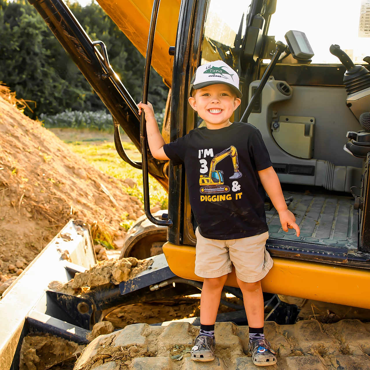 Jay joined the competition — help win amazing prizes! baseballcap, boy, cap, child, clothing, face, footwear, hardhat, hat, head, helmet, machine, male, person, photography, portrait, shoe, shorts, soil, t_shirt