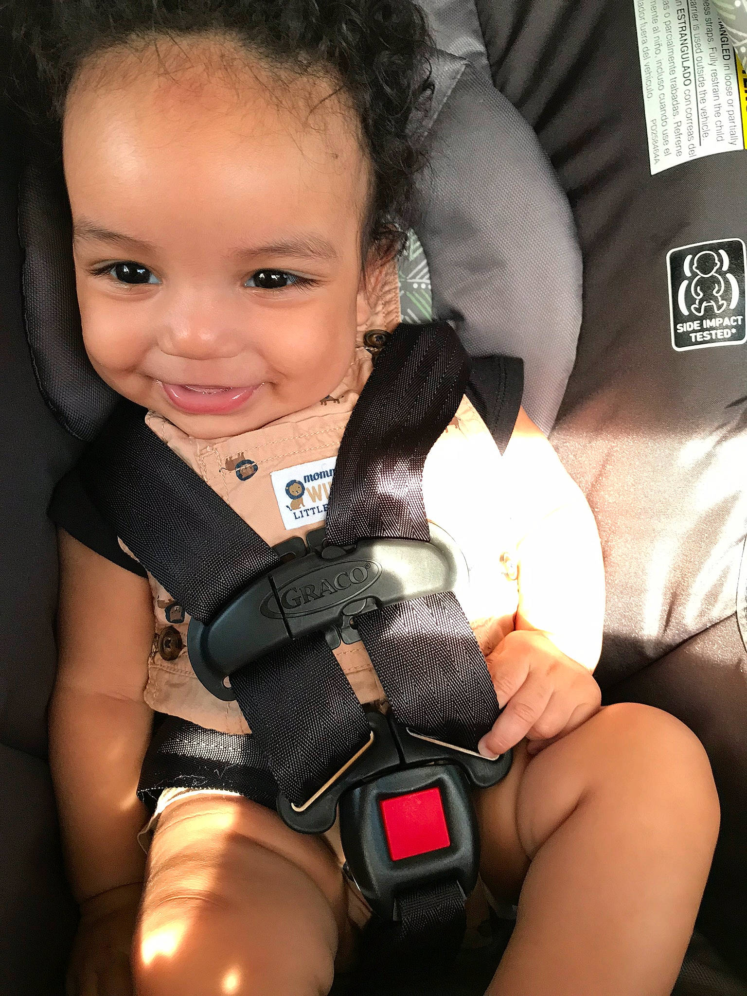 Khari is registered to the contest to win money with this photo: baby_carriage, black_hair, car_seat, child, joy, person, product, seat_belt, toddler