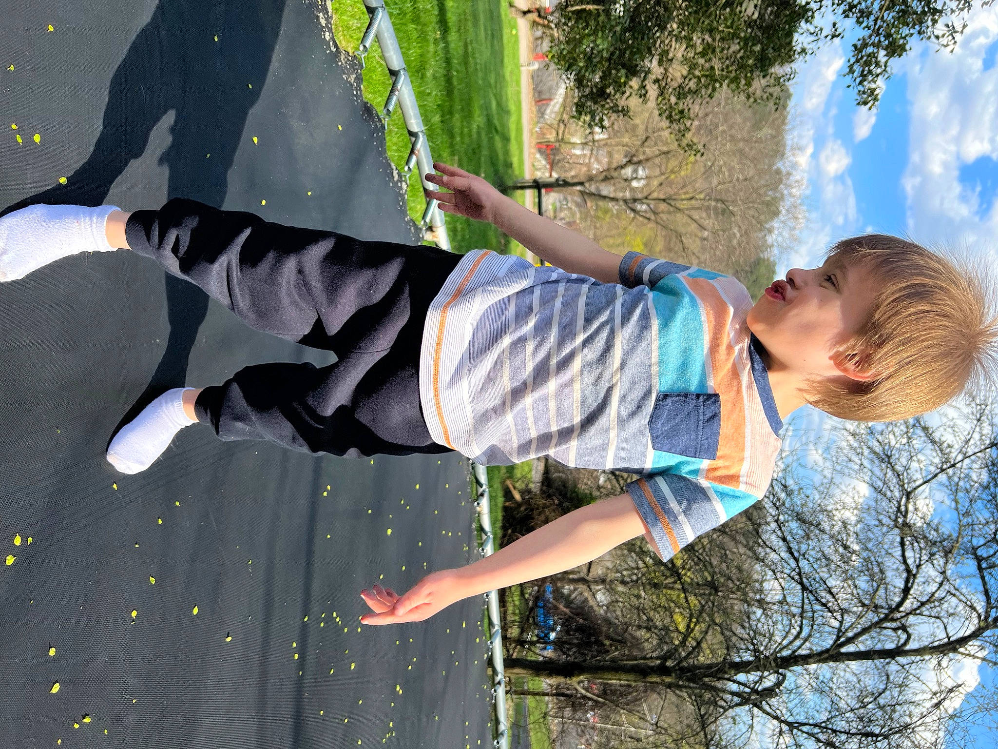 Jayce is registered to the contest to win money with this photo: adventure, child, cloud, entertainment, event, fun, grass, happy, jumping, leisure, people_in_nature, performing_arts, person, plant, recreation, shorts, sky, sneakers, t_shirt, toddler