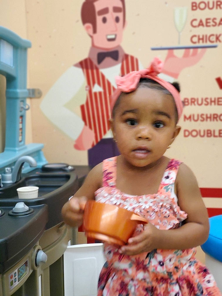 Aris joined the competition — help win amazing prizes! baby, child, cooking, event, fun, hairstyle, happy, kitchen, kitchen_appliance, leisure, organ, people, person, pink, recreation, room, sitting, t_shirt, tableware, toddler