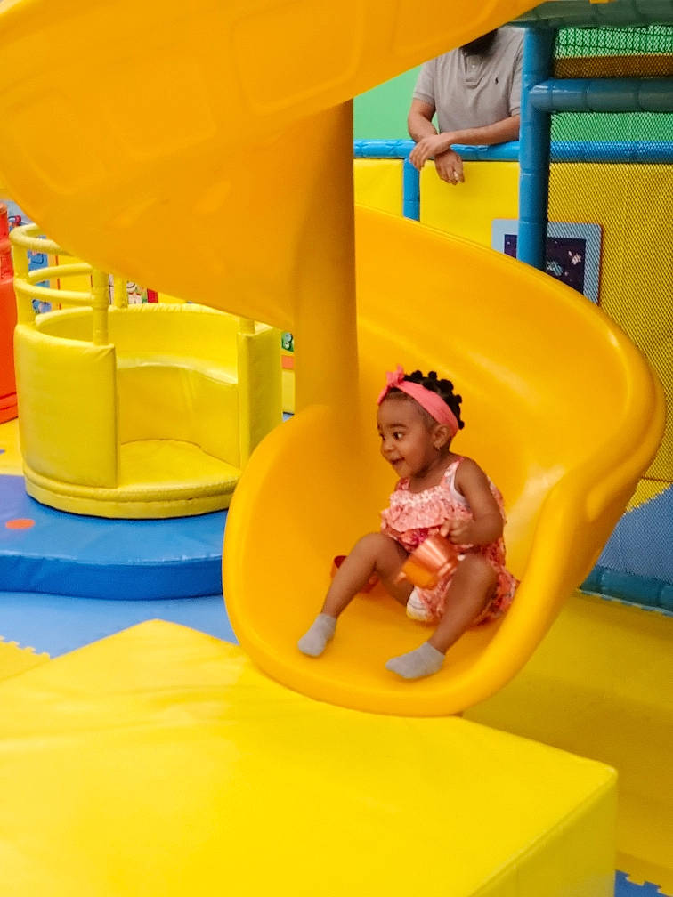 Aris is registered to the contest to win money with this photo: baby, baby_toddler_clothing, blue, child, chute, comfort, fun, happy, inflatable, leisure, nonbuilding_structure, outdoor_play_equipment, person, plastic, play, playground, recreation, smile, toddler, yellow