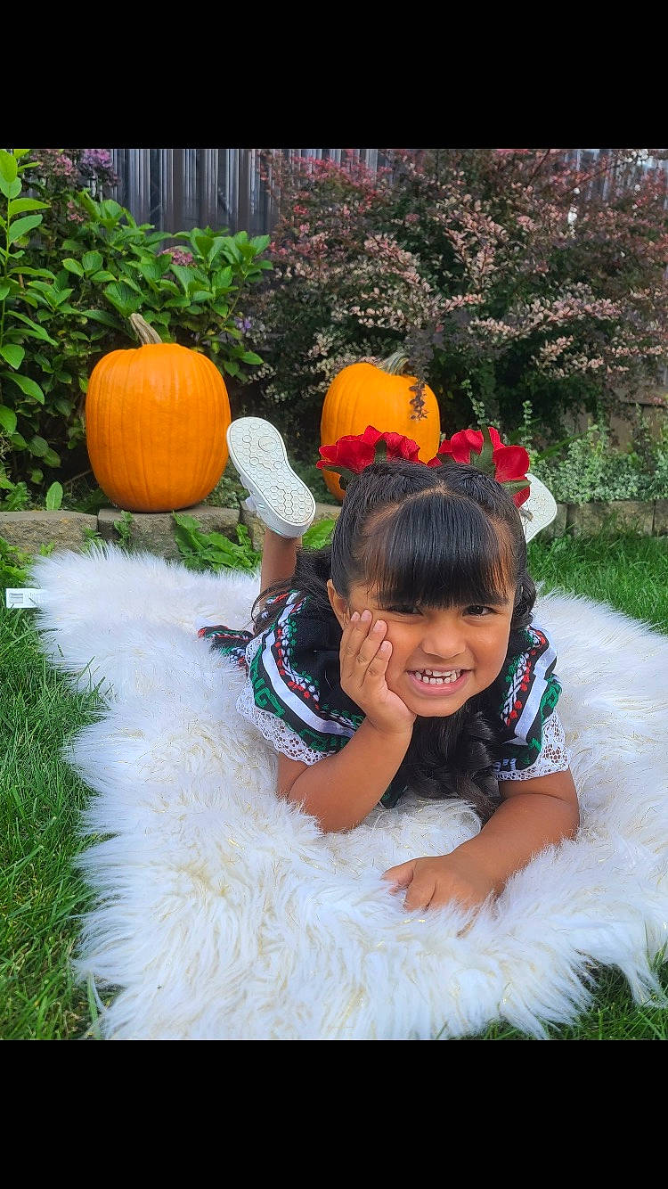 Kailani is registered to the contest to win money with this photo: botany, calabaza, cucurbita, eye, gourd, grass, happy, head, human_body, joy, leaf, leisure, natural_foods, nature, people_in_nature, person, plant, pumpkin, smile, squash