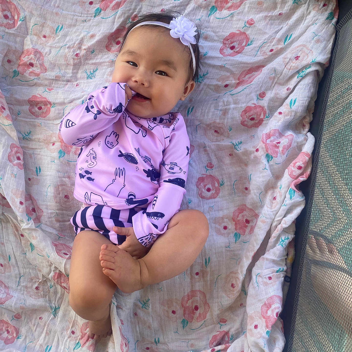 Haelyn is registered to the contest to win money with this photo: baby, bed, blanket, clothing, crib, dress, face, furniture, happy, head, infantbed, laughing, newborn, pajamas, person, photography, portrait, quilt, sitting, smile