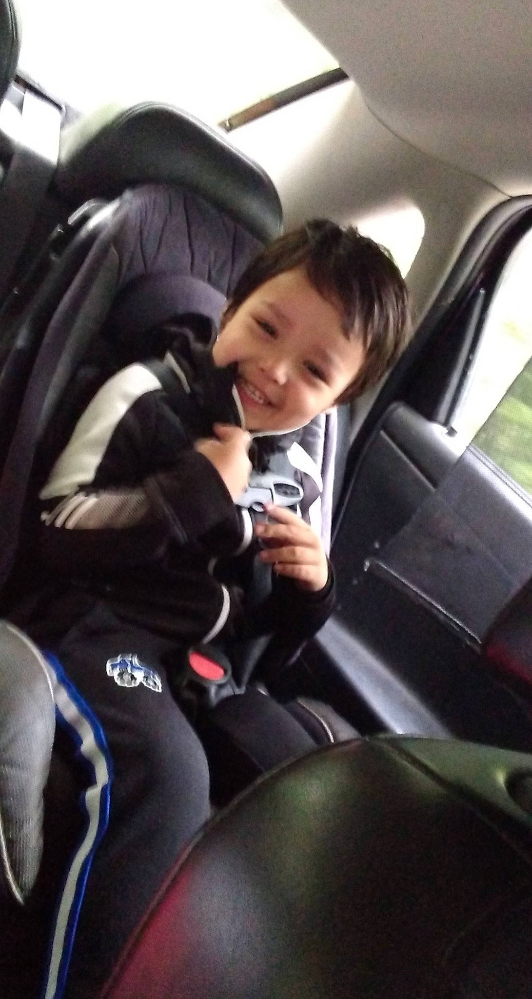 Calvin is registered to the contest to win money with this photo: air_travel, airline, automotive_window_part, baby_in_car_seat, baby_products, car_seat, car_seat_cover, comfort, door, dry_suit, family_car, head_restraint, joy, leather, passenger, person, seat_belt, service, thumb, vehicle_door