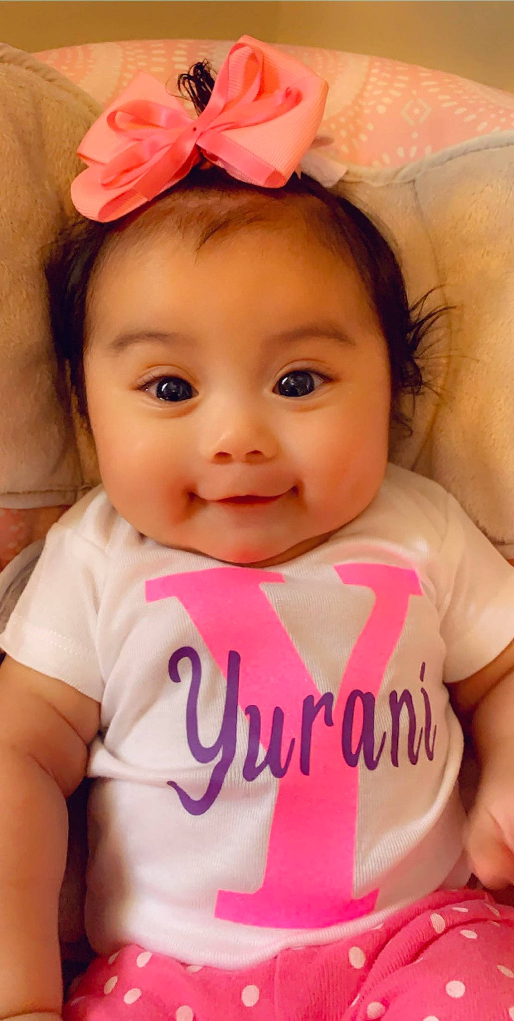 Yurani is registered to the contest to win money with this photo: baby, baby_making_funny_faces, baby_toddler_clothing, cheek, child, face, hair_accessory, happy, head, headband, headgear, lip, person, pink, skin, smile, toddler