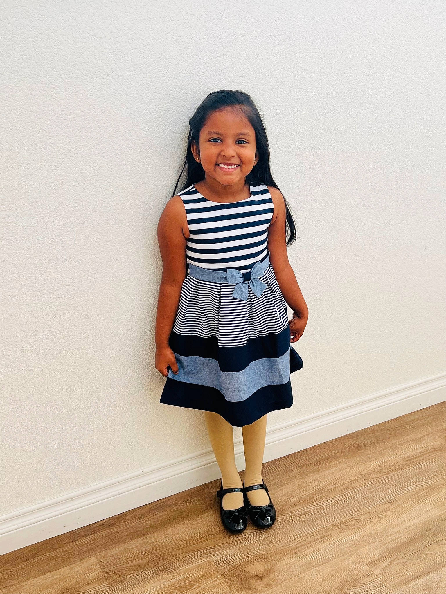 Lakeish is registered to the contest to win money with this photo: baby_toddler_clothing, black_hair, clothing, day_dress, dress, face, fashion_design, footwear, hair, happy, human_body, joy, knee, leg, neck, one_piece_garment, person, shoe, sleeve, smile