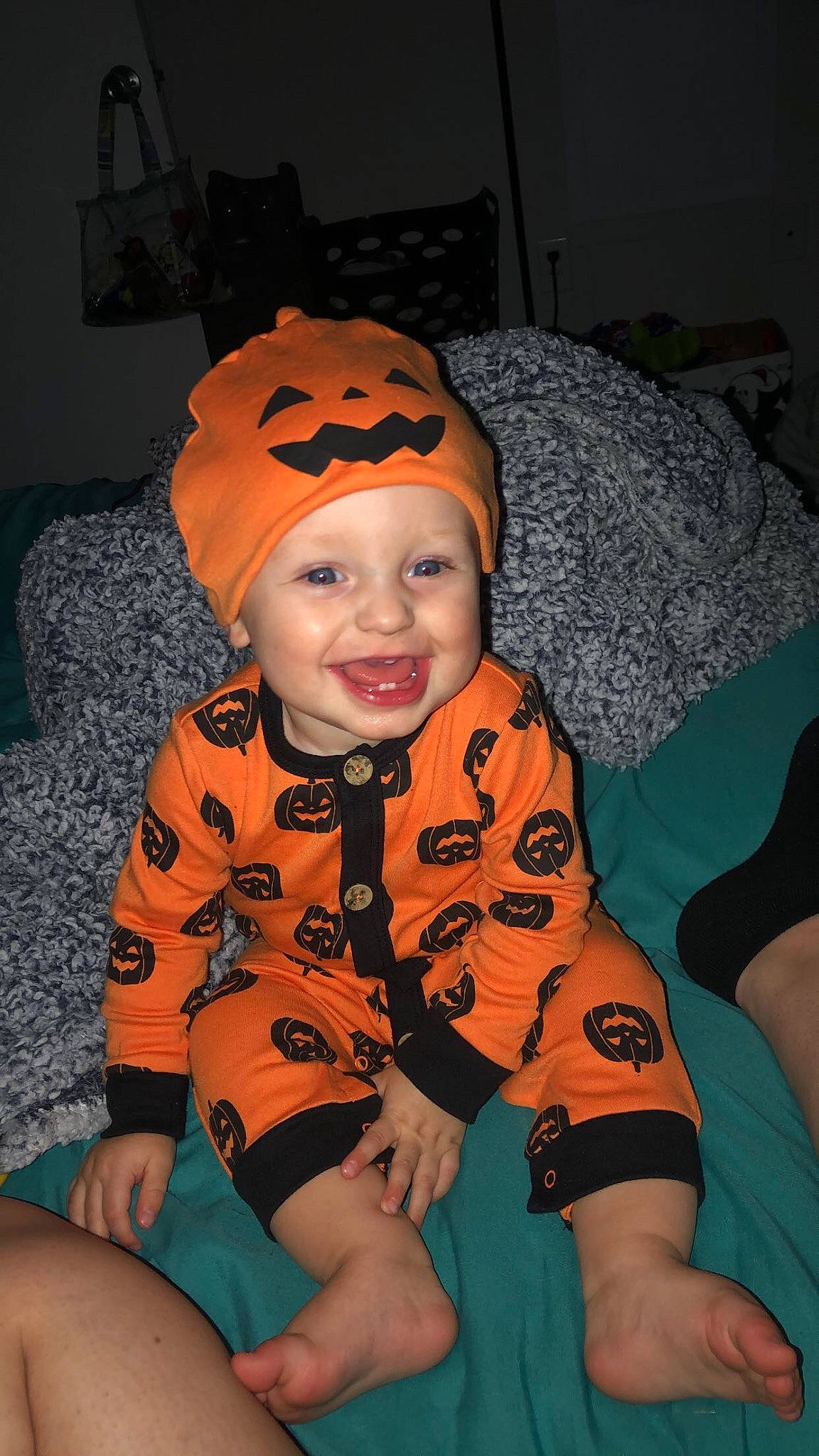 Bryliex is registered to the contest to win money with this photo: baby, baby_toddler_clothing, cheek, child, comfort, cool, eye, flash_photography, fun, happy, headwear, human_leg, knee, mouth, orange, person, personal_protective_equipment, sitting, sleeve, smile