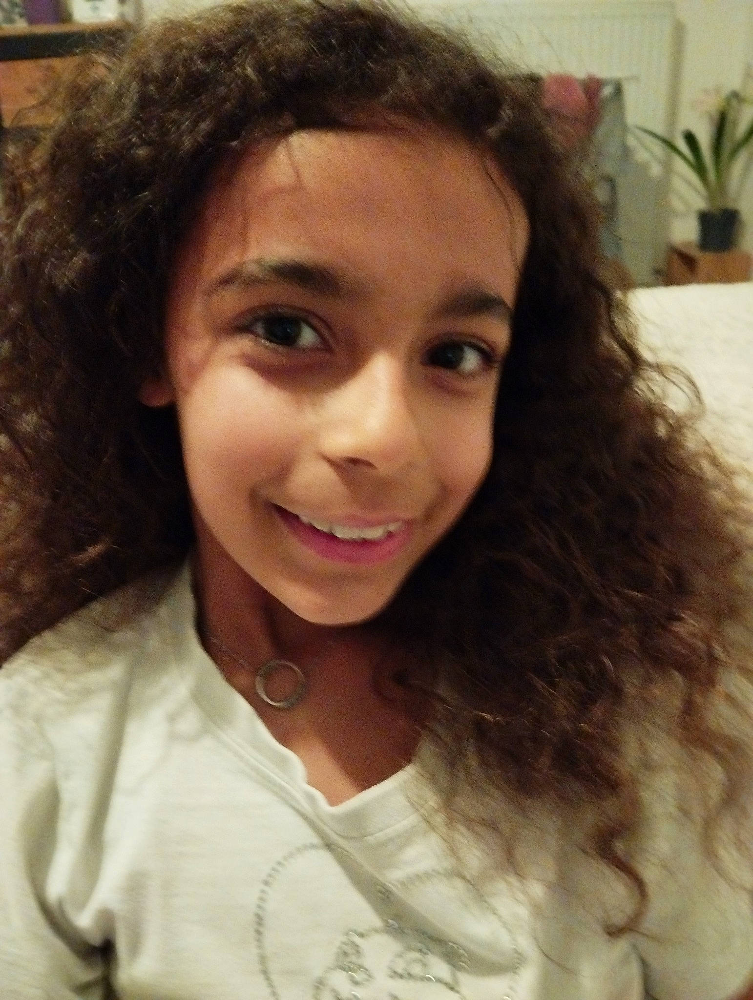 Zoé participe au concours pour gagner de l'argent avec cette photo : black_hair, cheek, chin, cool, eyebrow, eyelash, forehead, hair, happy, houseplant, iris, jaw, joy, layered_hair, lip, mouth, nose, person, plant, selfie