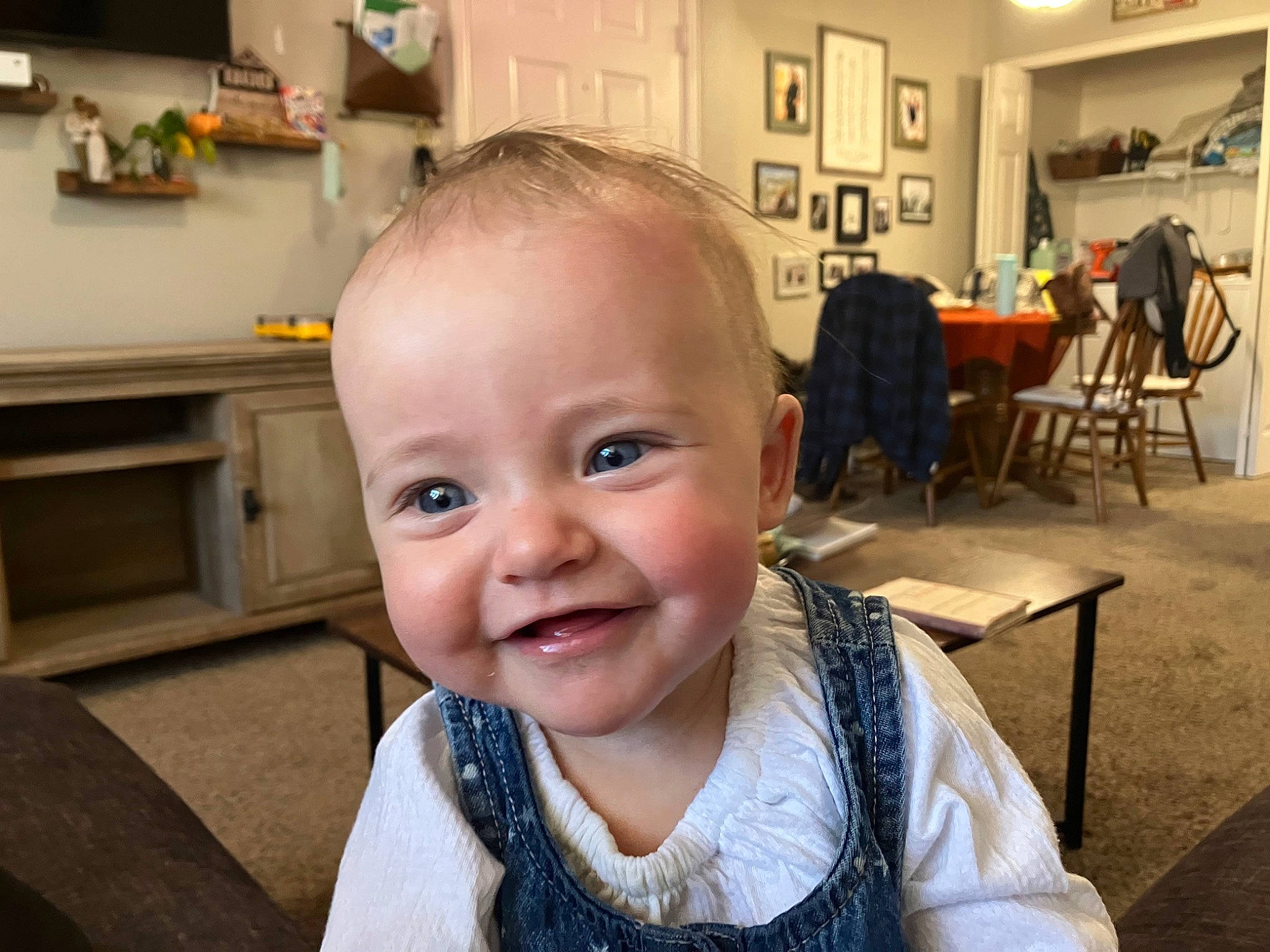 Emery joined the competition — help win amazing prizes! baby, baby_toddler_clothing, chair, cheek, child, chin, ear, flooring, fun, happy, iris, joy, person, picture_frame, room, sitting, smile, t_shirt, table, toddler