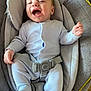 baby, baby_boy, baby_seat, child, clothing, comfort, cute, happy, head_support, indoor, infant, joyful, laughing, newborn, onesie, padded, person, seat, smiling, straps