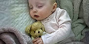 Saylor joined the competition — help win amazing prizes! baby, bed, blanket, child, comfort, cozy, cute, fabric, face, hand, indoor, infant, nap, peaceful, portrait, rest, sleeping, soft_toys, teddy_bear, warm