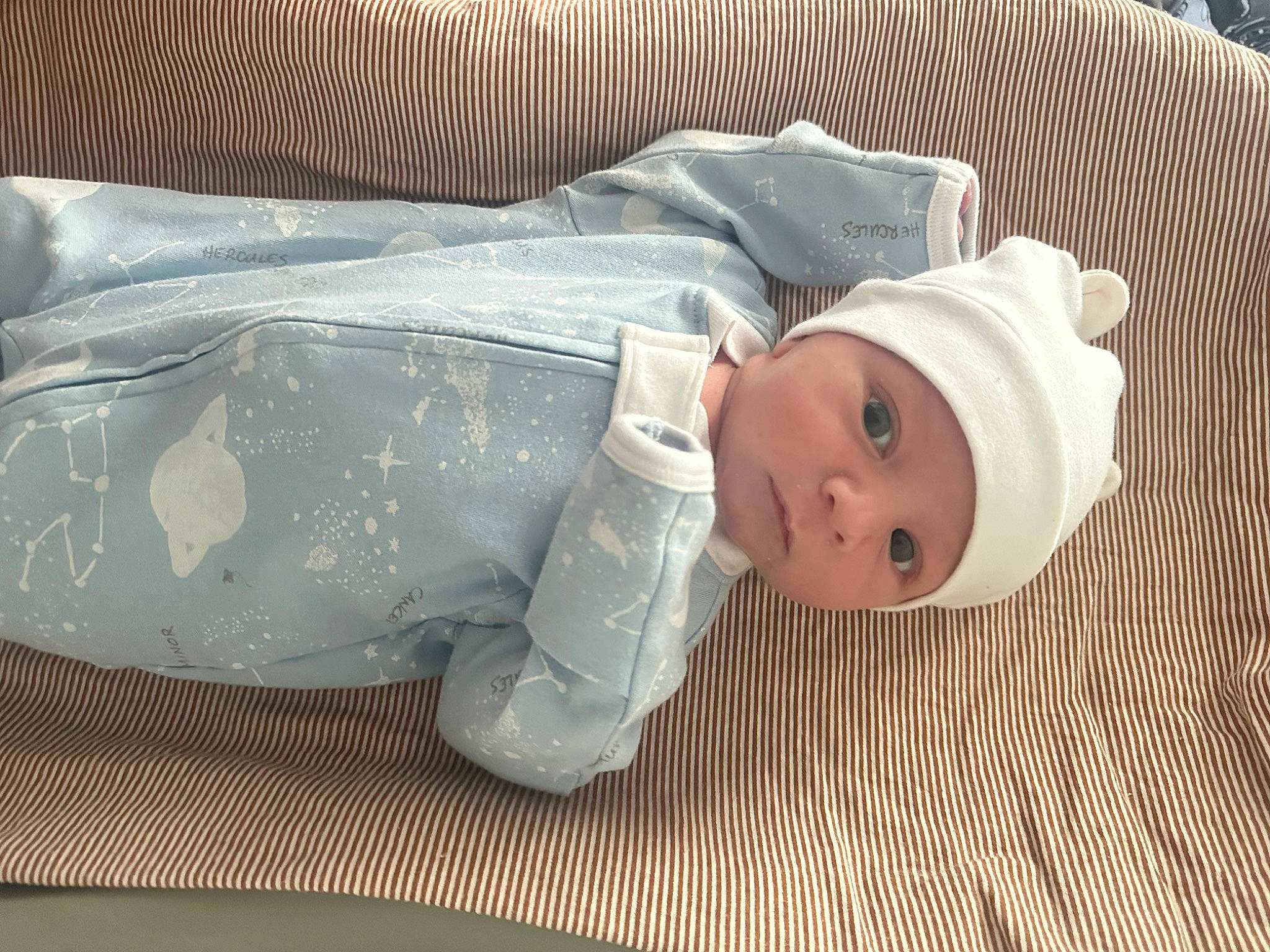 Caden is registered to the contest to win money with this photo: baby, baby_products, baby_safety, baby_sleeping, baby_toddler_clothing, child, comfort, hat, headwear, linens, person, product, room, sleep, textile, toddler, wood