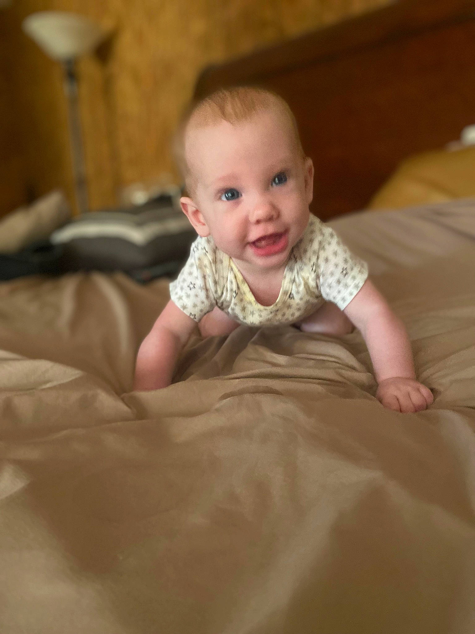 Samantha is registered to the contest to win money with this photo: baby, baby_toddler_clothing, cheek, child, comfort, flash_photography, floor, flooring, fun, happy, hardwood, iris, joy, person, portrait_photography, room, sitting, skin, sleeve, smile