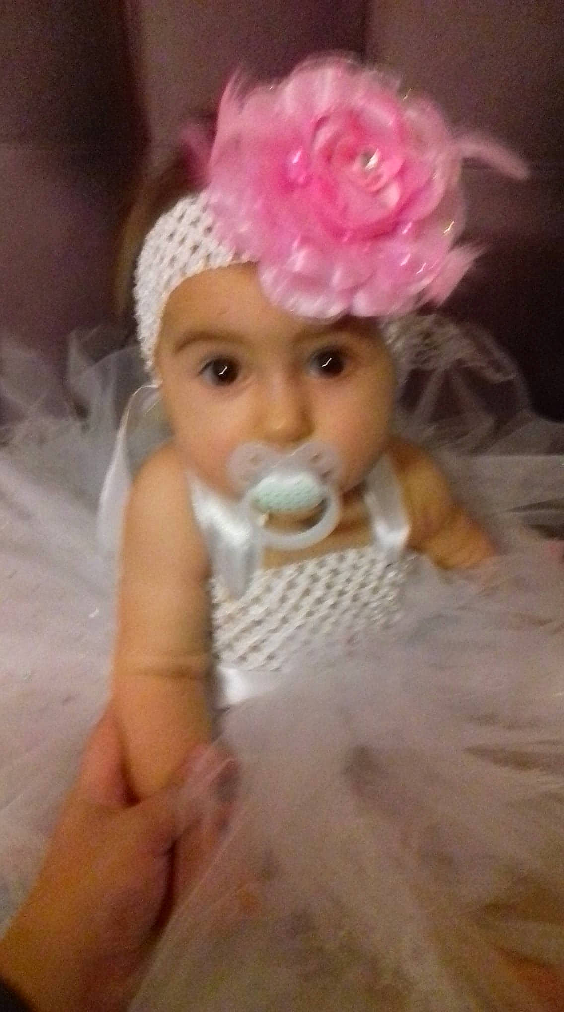 Kelsya participe au concours pour gagner de l'argent avec cette photo : child, doll, girl, hair_accessory, head, headgear, headpiece, infant, person, pink, skin, toddler