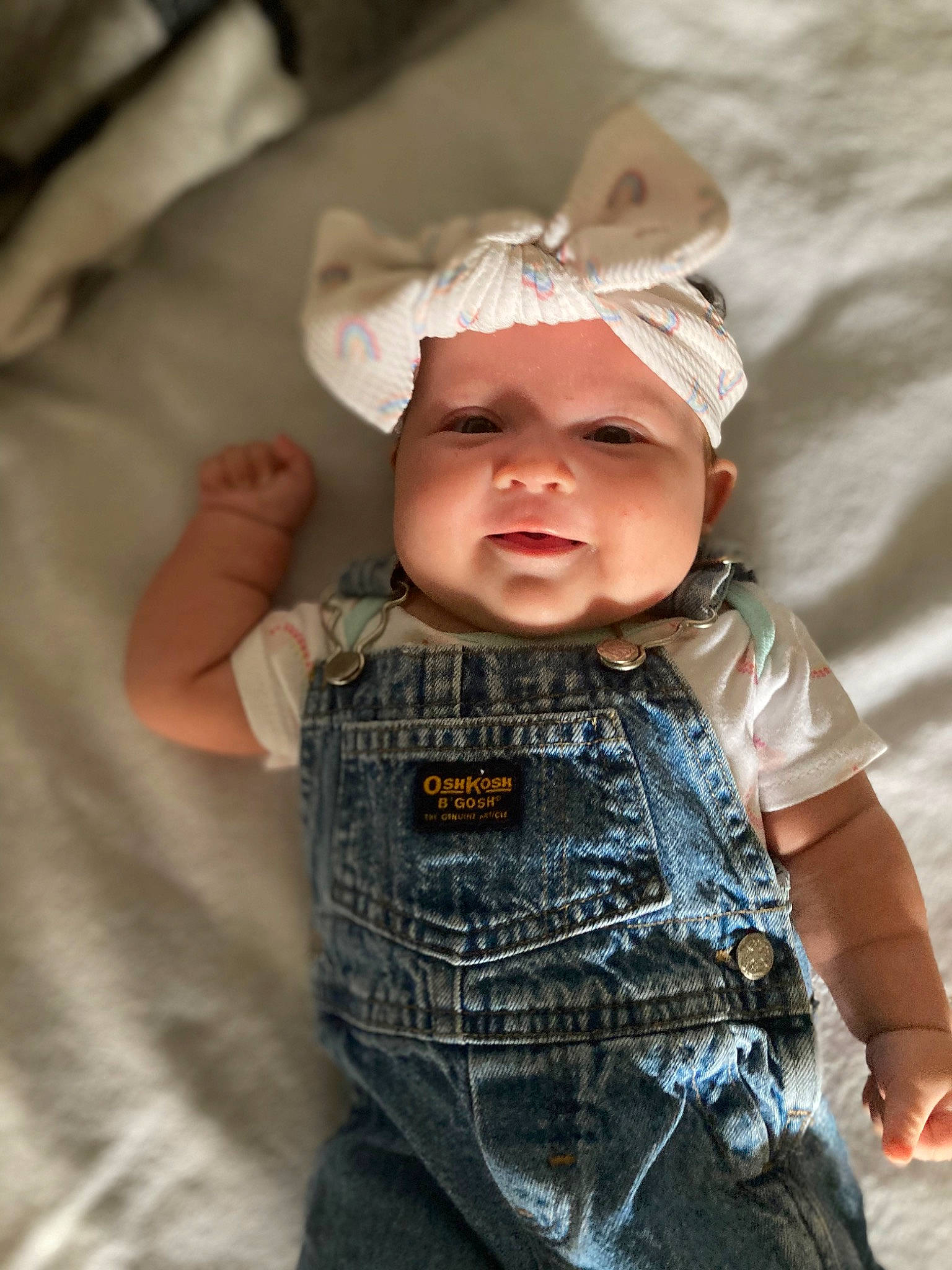 Esme joined the competition — help win amazing prizes! baby, baby_toddler_clothing, cap, cheek, child, dress, eye, fashion_accessory, flash_photography, fun, gesture, grass, happy, headgear, headwear, pattern, person, personal_protective_equipment, skin, sleeve