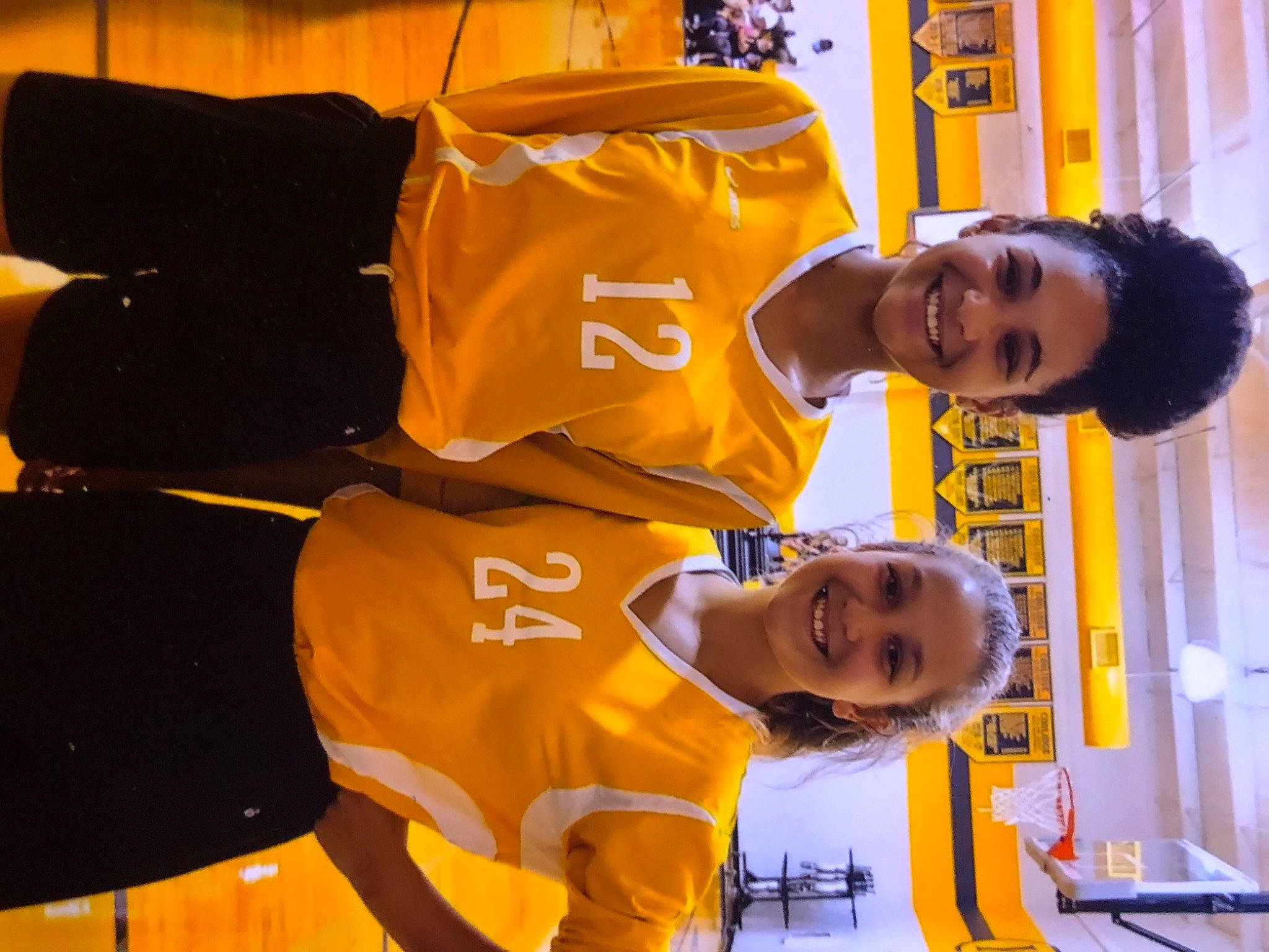 Sarah is registered to the contest to win money with this photo: event, fun, happy, hat, jersey, joy, leisure, orange, person, player, room, shirt, shorts, sleeve, smile, sports_jersey, sports_uniform, sportswear, t_shirt, team