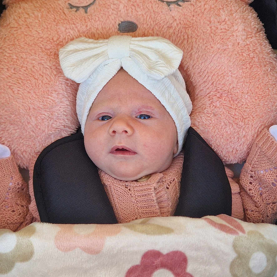 Ivy joined the competition — help win amazing prizes! baby, bed, bonnet, clothing, cradle, crib, cushion, face, furniture, glove, hat, head, homedecor, infantbed, newborn, person, photography, portrait, transportation, vehicle