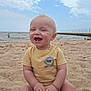 baby, beach, sand, ocean, sky, clouds, pier, toy, yellow_shirt, happy, child, smiling, water, outdoor, summer, sunny, sitting, person, play, nature