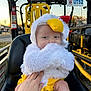 baby, child, costume, chicken, fluffy, seat, hand, yellow, black, outdoor, vehicle, metal, sunset, face, person, cute, infant, portrait, clothing, expression