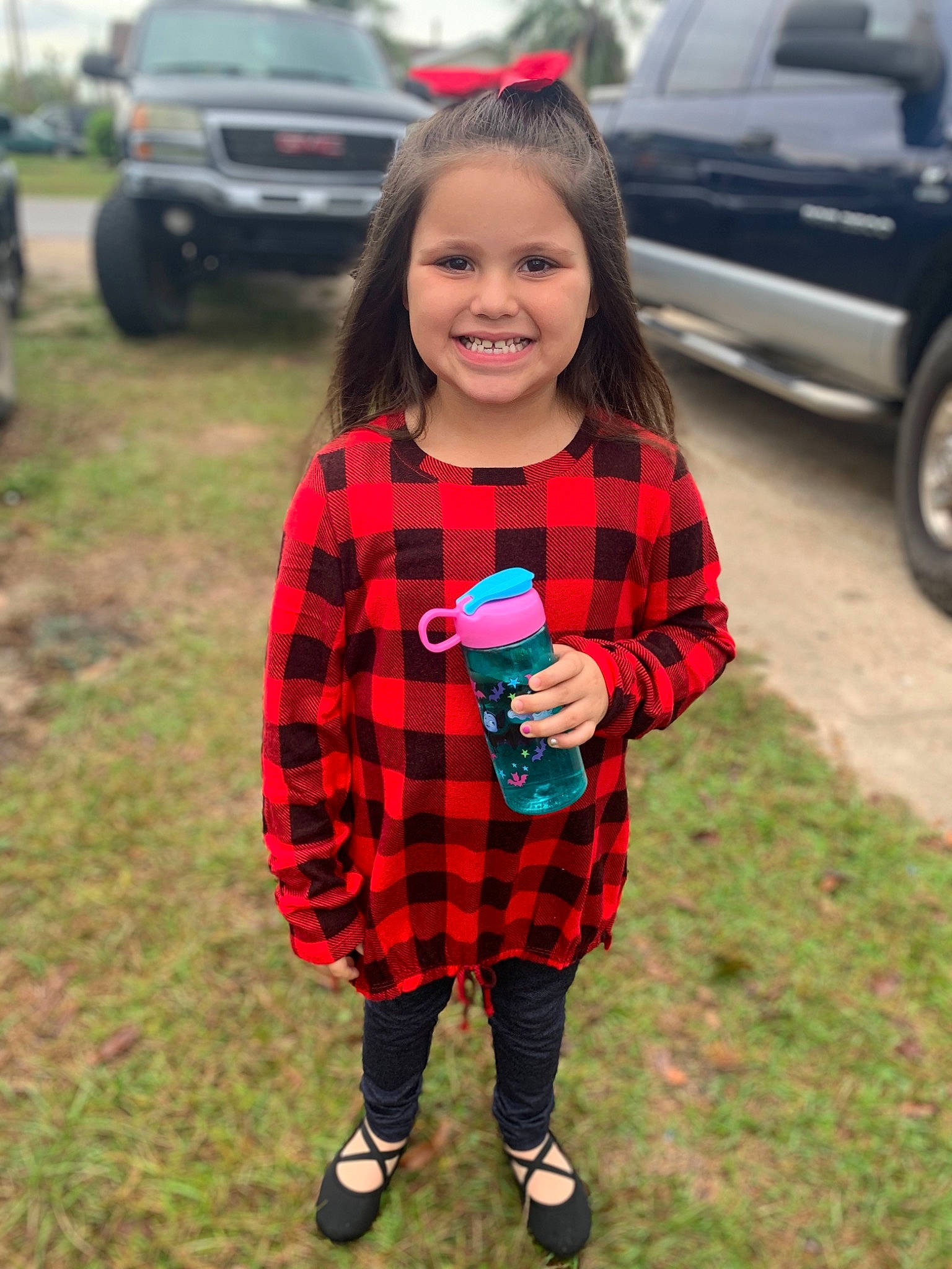 Railynn is registered to the contest to win money with this photo: car, child, city_car, clothing, design, grass, joy, pattern, person, plaid, plant, recreation, sleeve, style, t_shirt, tartan, textile, toddler, vehicle