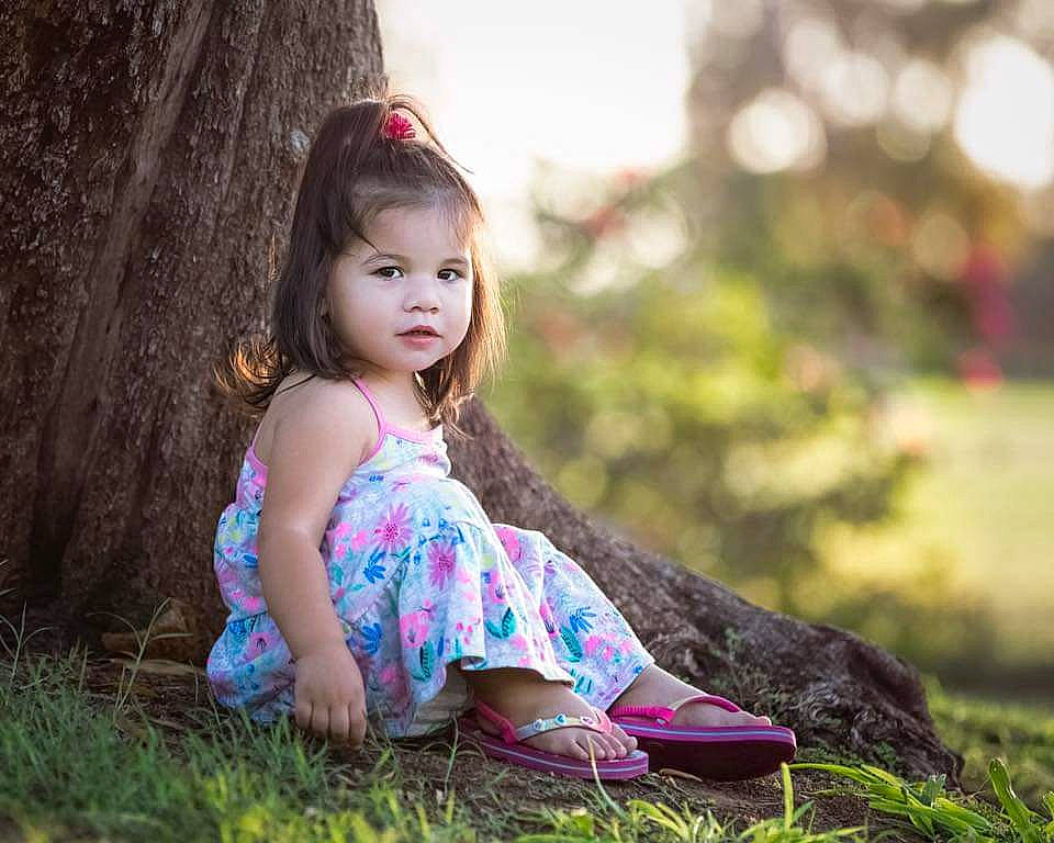 Emiliana is registered to the contest to win money with this photo: beauty, child, child_model, dress, eye, grass, hair, hairstyle, lady, long_hair, people_in_nature, person, photograph, photography, pink, sitting, skin, spring, summer, toddler