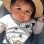 toddler, child, hat, straw_hat, mickey_mouse, sweatshirt, car_seat, seatbelt, face, portrait, indoors, baby, clothing, person, cute, expression, sunlight, seat, safety, young_child