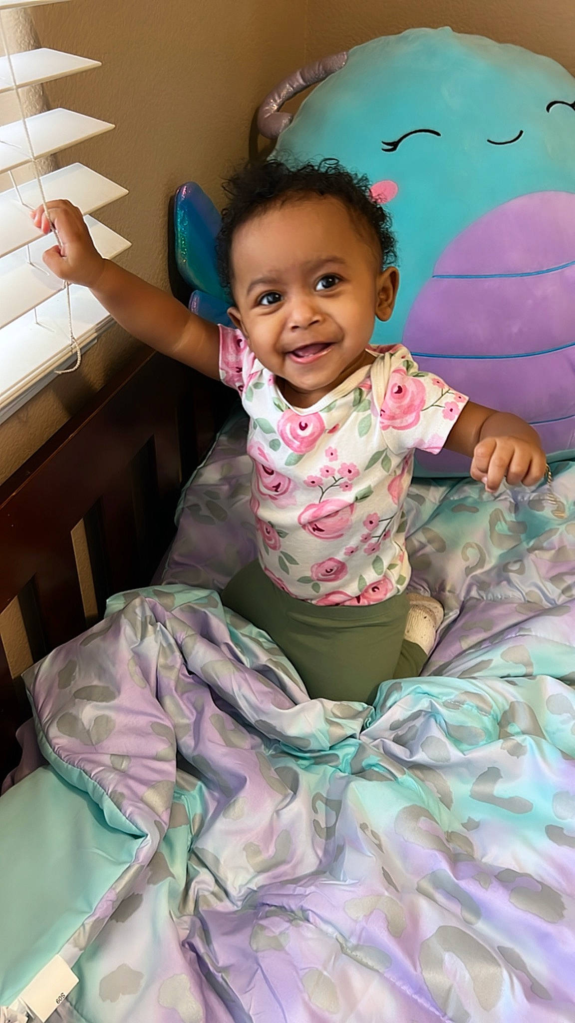 Xuri is registered to the contest to win money with this photo: arm, baby_toddler_clothing, eye, face, facial_expression, hair, hairstyle, happy, head, human_body, joy, neck, person, pink, product, purple, skin, sleeve, smile, standing