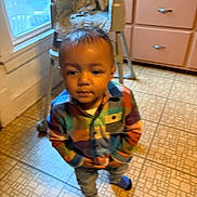 Chozyn joined the competition — help win amazing prizes! child, toddler, boy, portrait, standing, indoors, kitchen, plaid_shirt, colorful_clothing, pants, socks, short_hair, serious_expression, face, hands_in_pockets, floor, chair, window, dresser, home