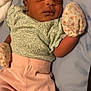 Denver Stallings is registered to the contest to win money with this photo: baby, sleeping, infant, headband, mittens, pink_pants, green_top, floral_pattern, blanket, bed, peaceful, cute, clothing, newborn, lying_down, indoors, soft_light, portrait, child, resting